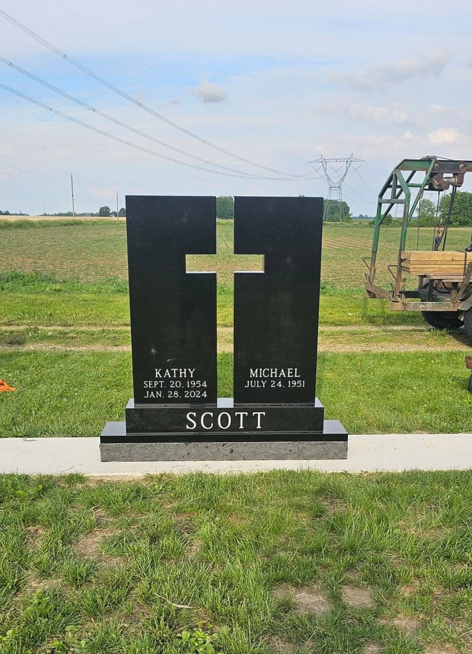Black granite Scott family cross monument set by Family Burial Services